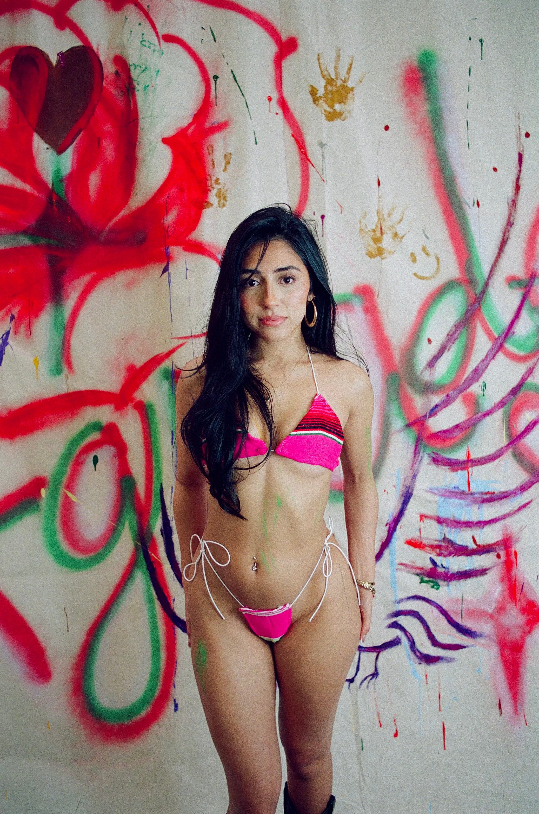 model wearing la rosa bikini with graffiti background